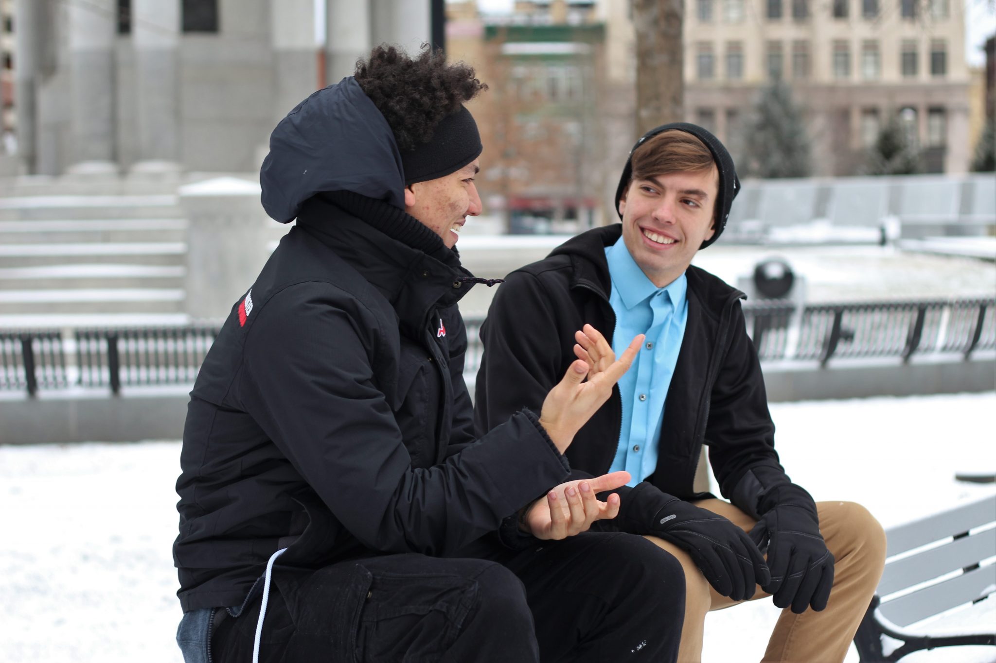 men talking outside in winter