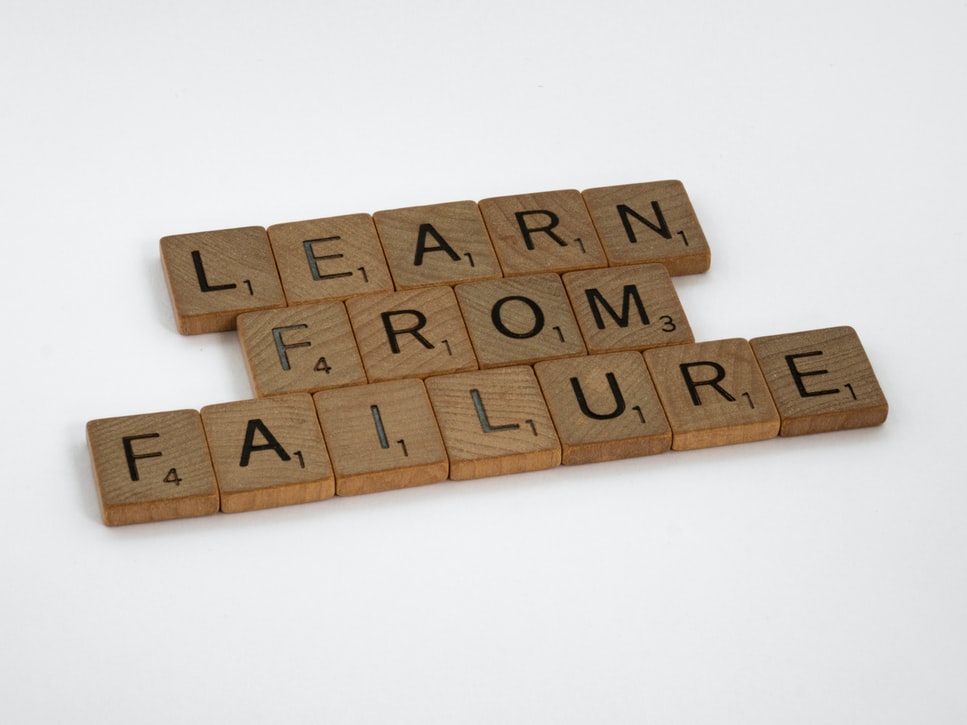 scrabble letters that read "learn from failure"