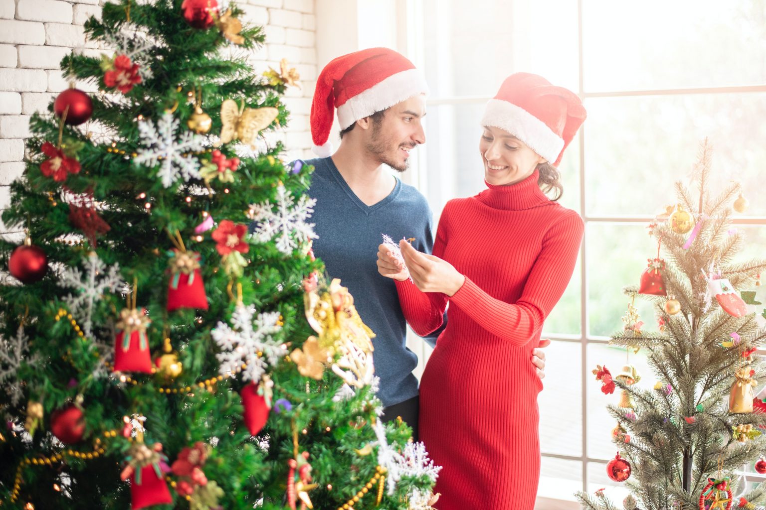 couple wearing santa hats