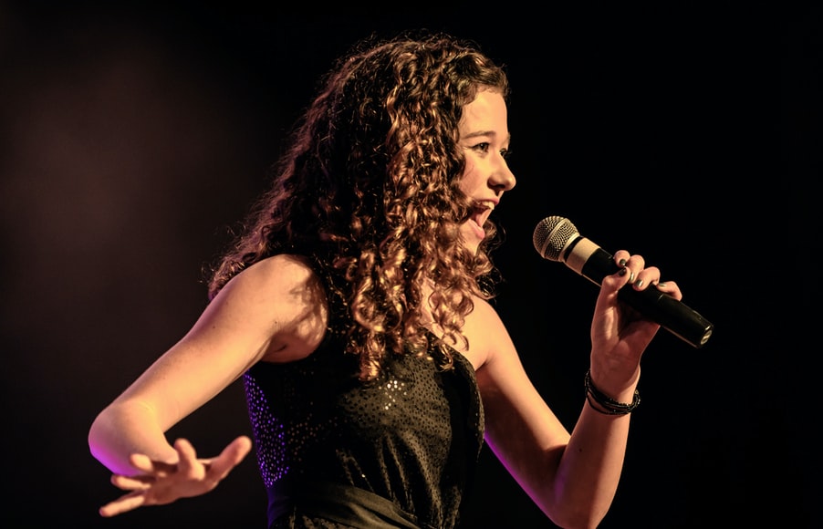 woman singing onstage