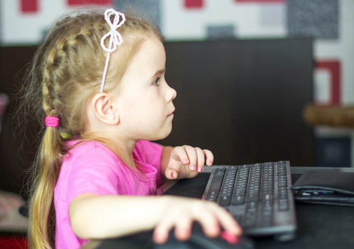 young girl on computer