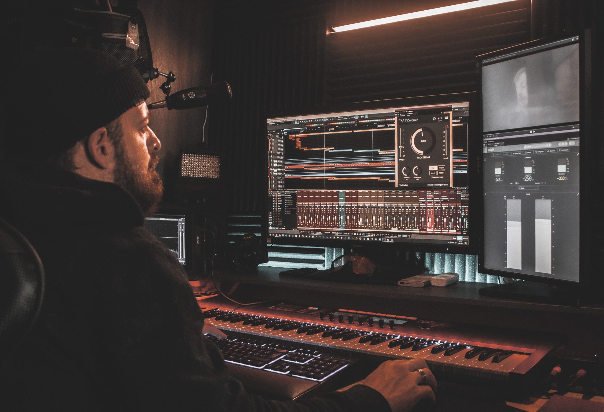 man working with music production equipment