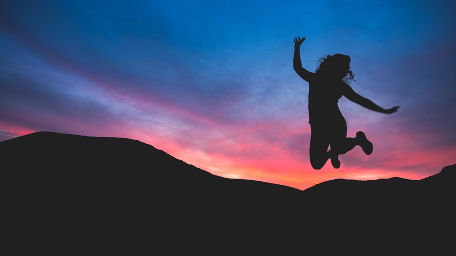 silhouette of woman jumping