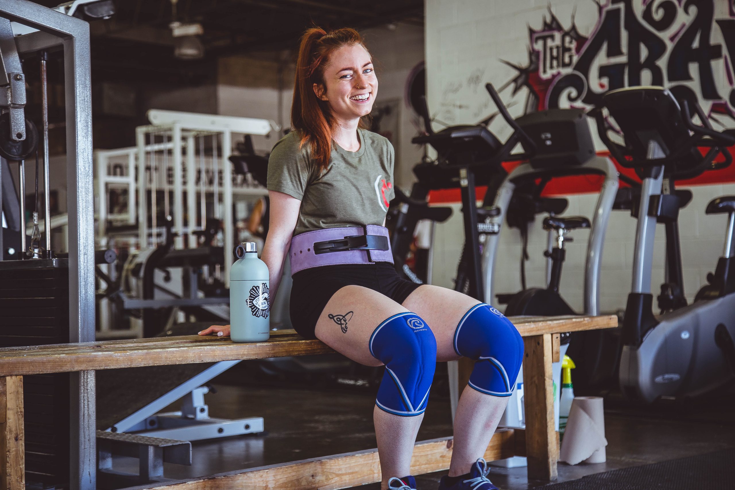 woman smiling at a gym