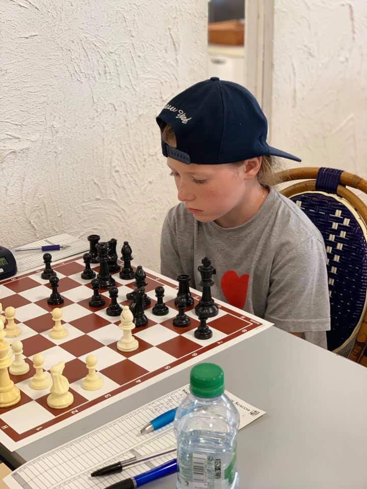 kid playing chess