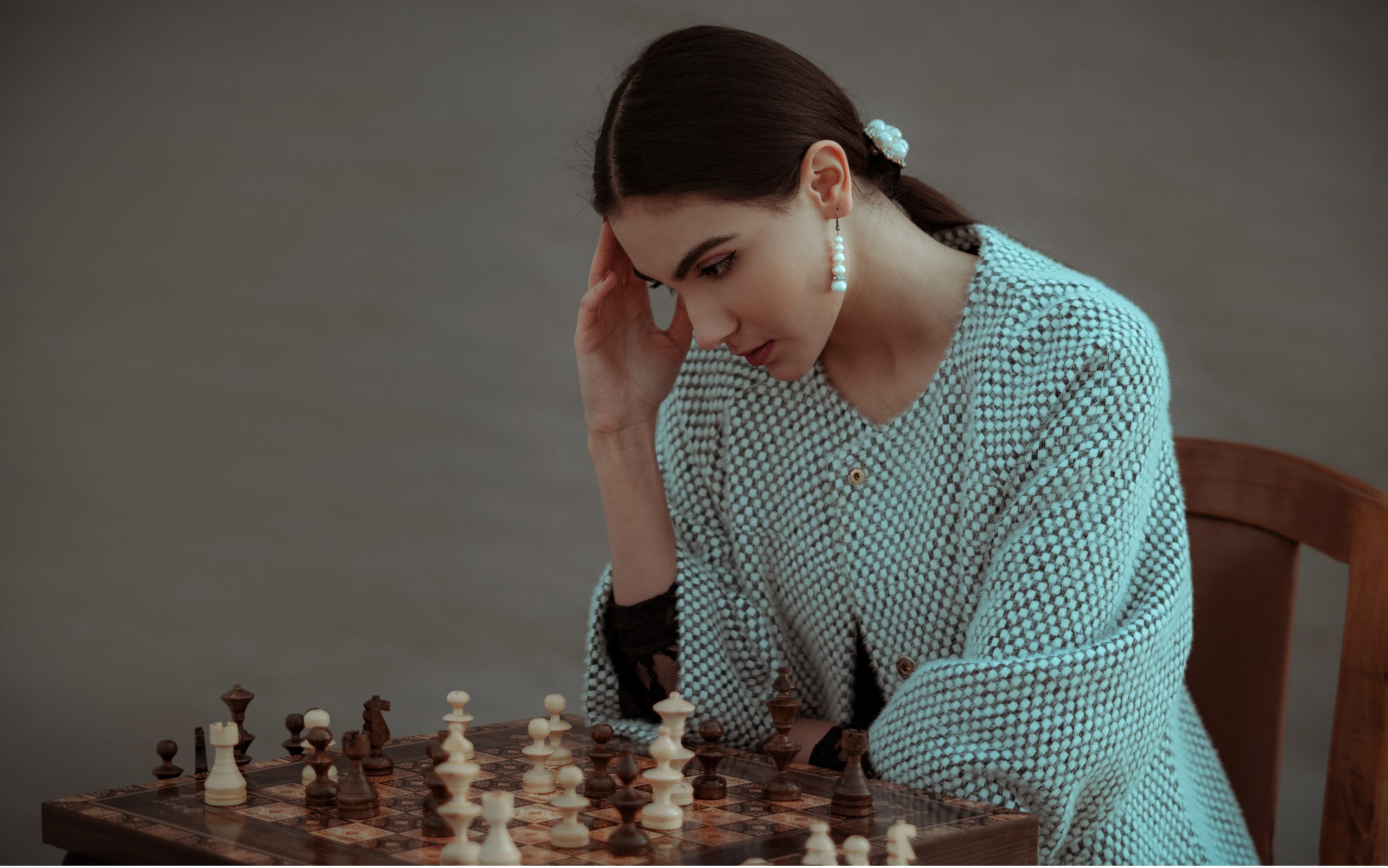 woman playing chess