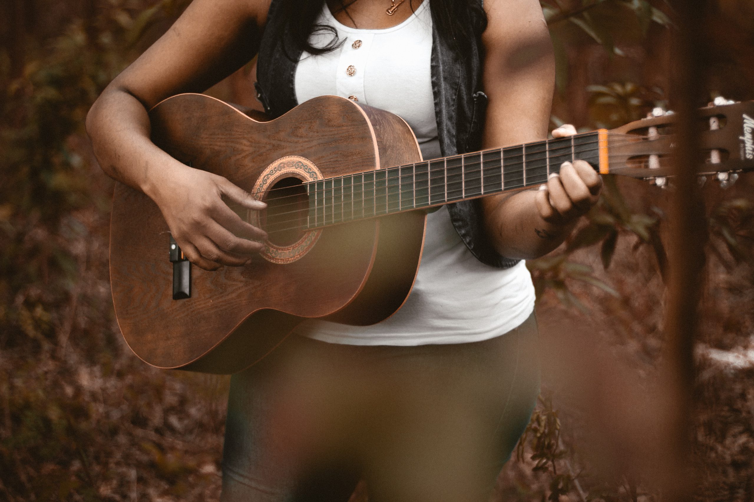 woman playing acoustic guitar