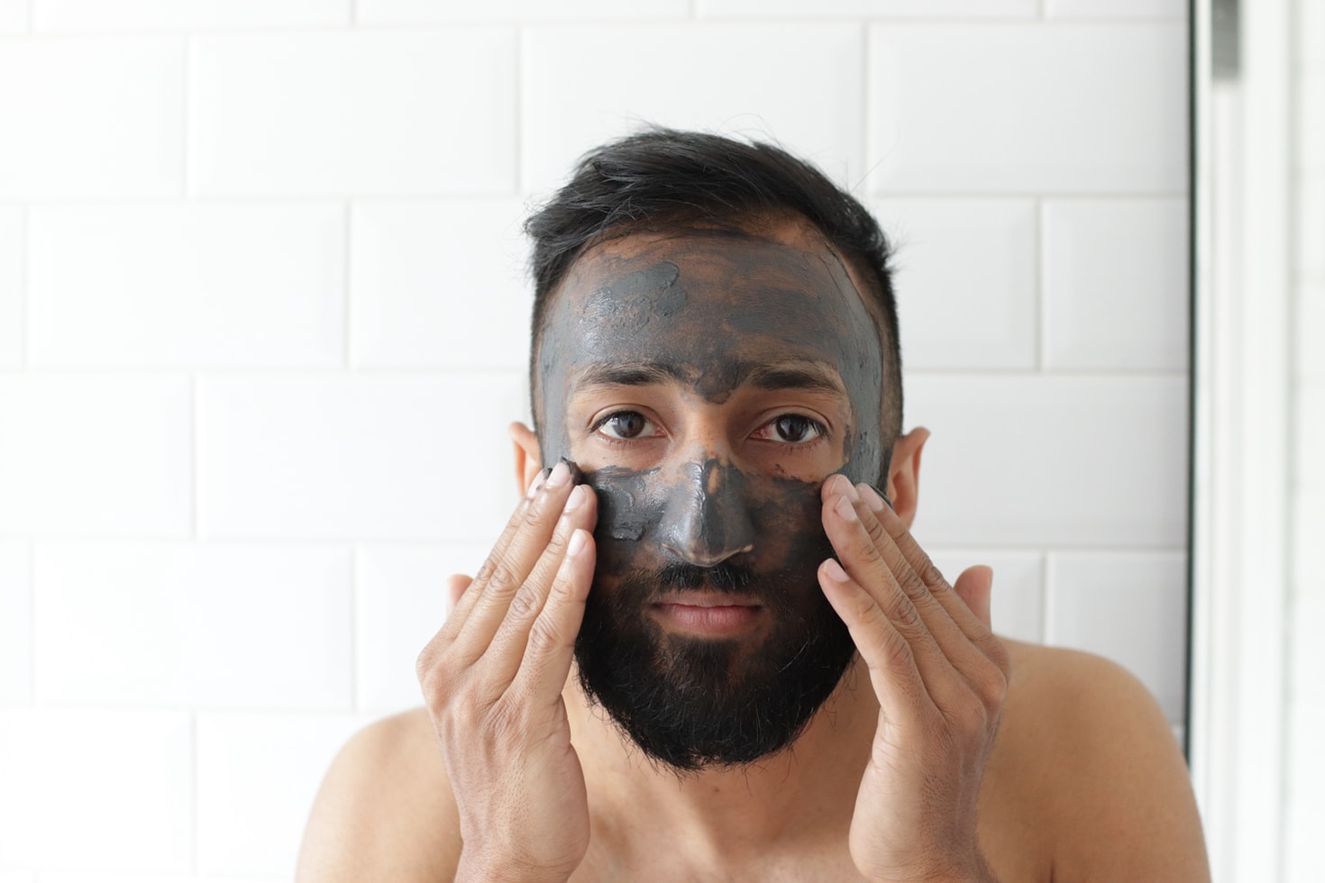 Man Applying Charcoal Face pack