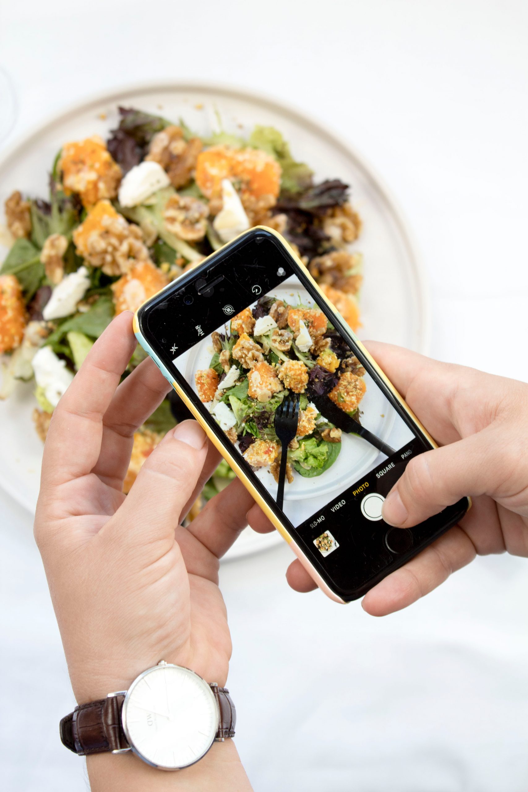 Person Taking Photo of Food in Mobile Phone