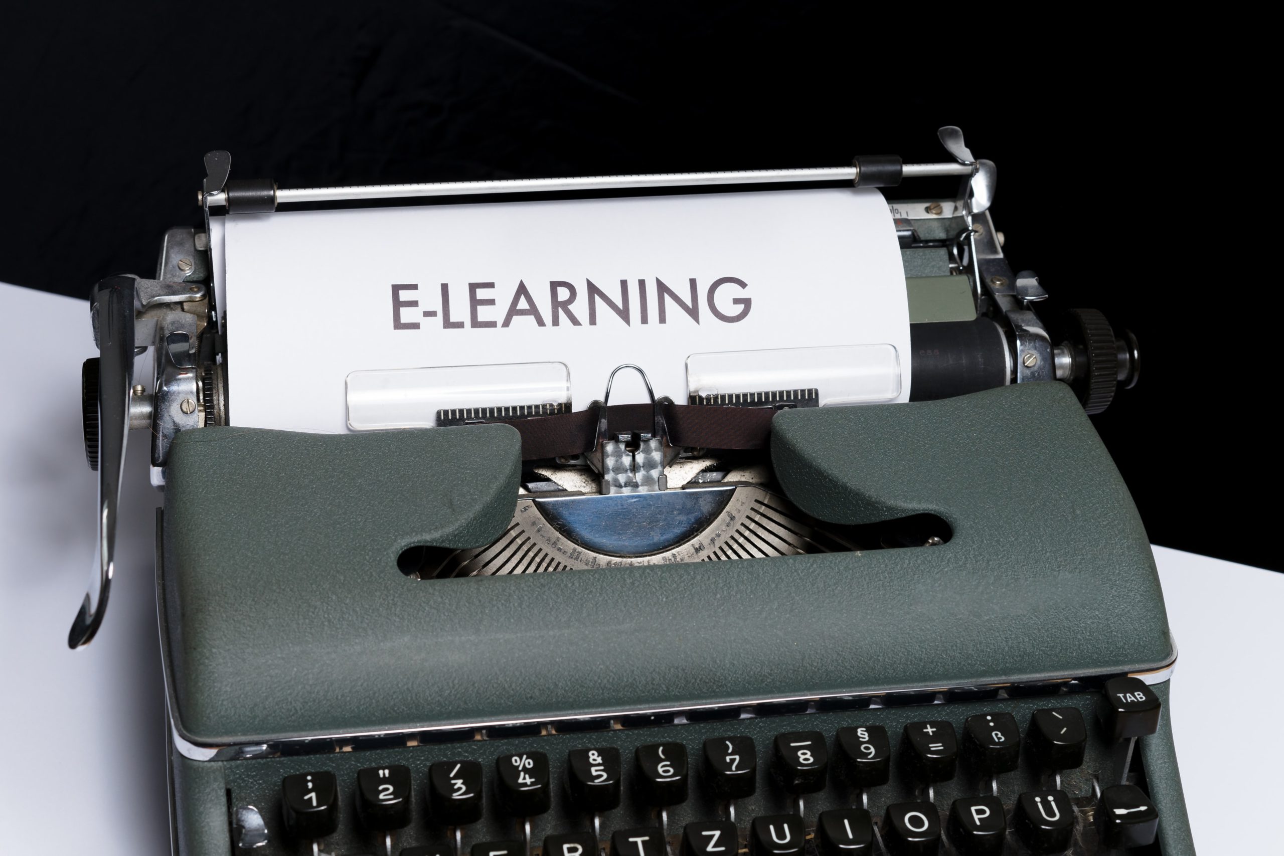 typewriter with the words "E-Learing" printed on paper