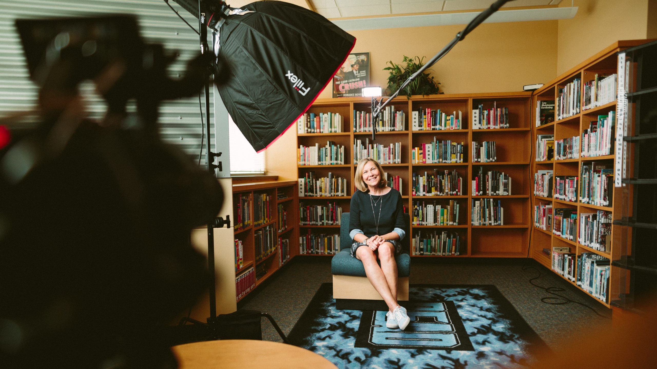 woman being interviewed in a library