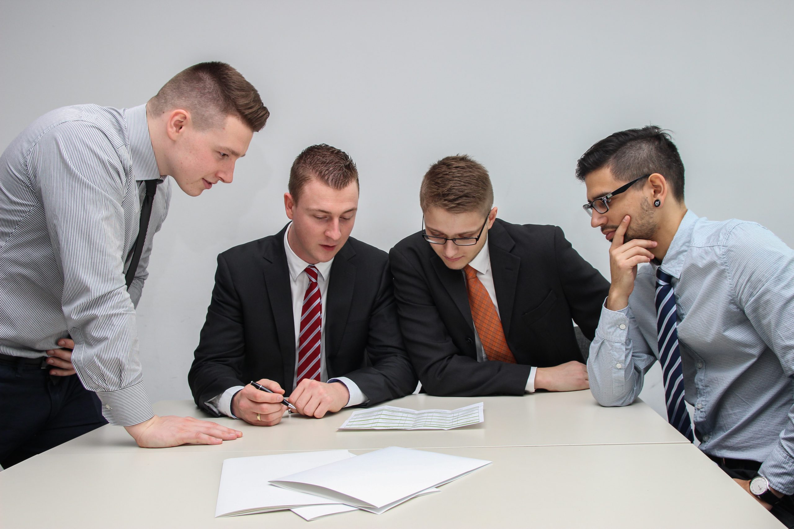 business men looking at a paper