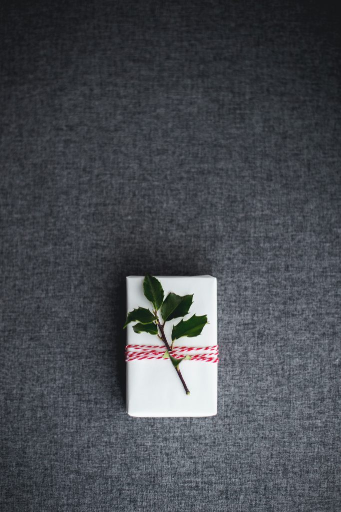 small white gift on a grey background