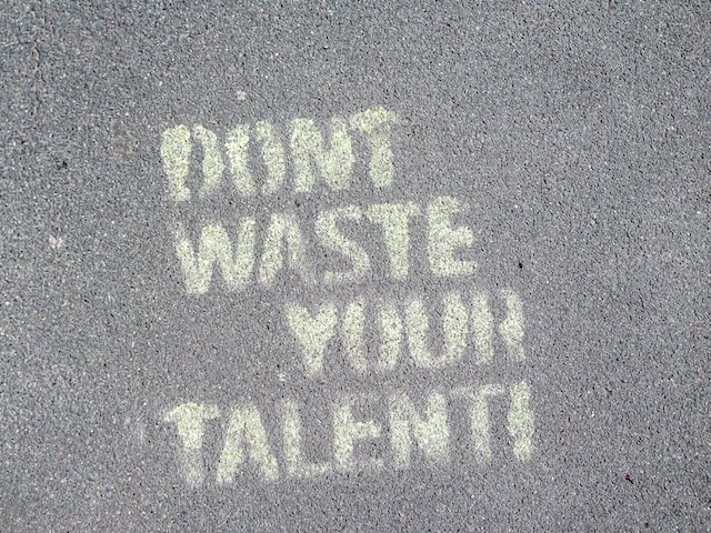 sidewalk chalk that reads 'don't waste your talent'