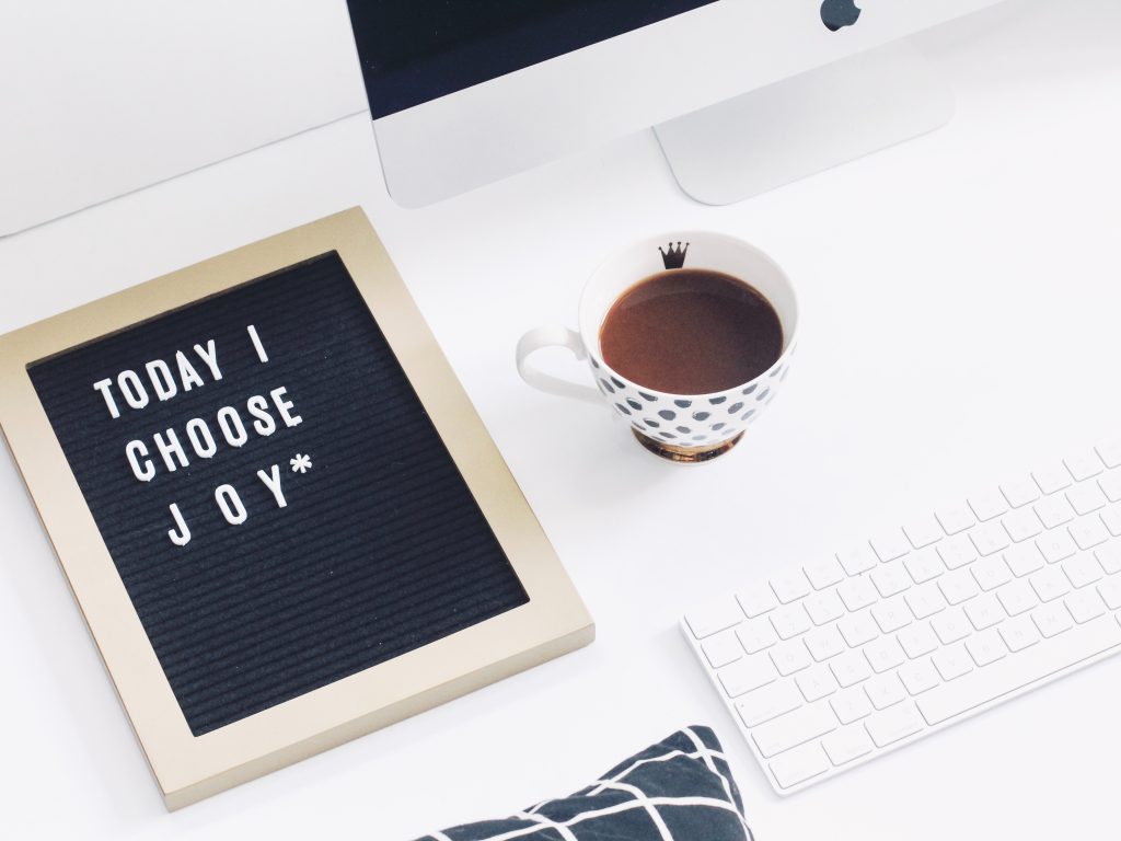 sign on a desk that reads "today I choose joy"