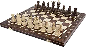 brown and white carved chess board